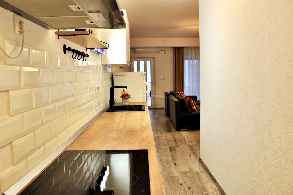 Stanovanje v pritličju s teraso in parkirnim mestom v garaži